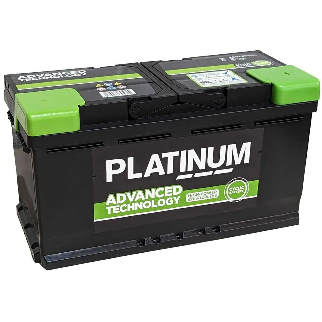 A black automotive battery with bright green terminal covers and a large white and green 'PLATINUM' brand label on the front, photographed on a plain white background.