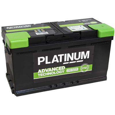A black automotive battery with bright green terminal covers and a large white and green 'PLATINUM' brand label on the front, photographed on a plain white background.
